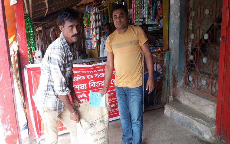 নানিয়ারচরে ১০ টাকার চাল বিতরণ